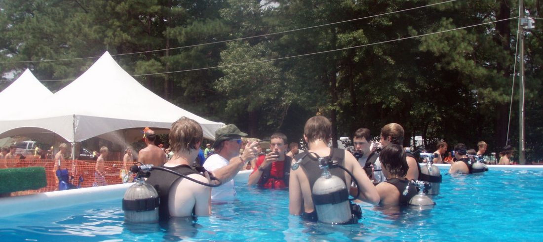 Youth experiencing introductory scuba with NAUI professionals at Summit Bechtel Reserve, 2026 National Scout Jamboree.